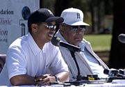 With his father Earl Woods (16 April 2004)