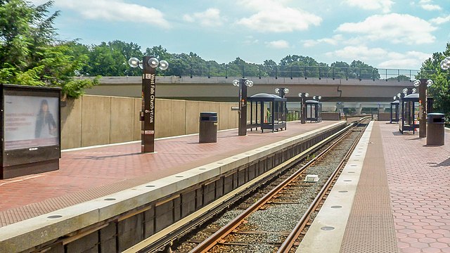 A view of the east end of the platforms in May 2015, open to the weather. The Silver Line viaduct can be seen in the distance