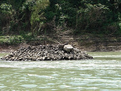 The Pile in the Usumacinta river thought to have possibly supported a suspension bridge at Yaxchilan Yaxchilan Pile.JPG