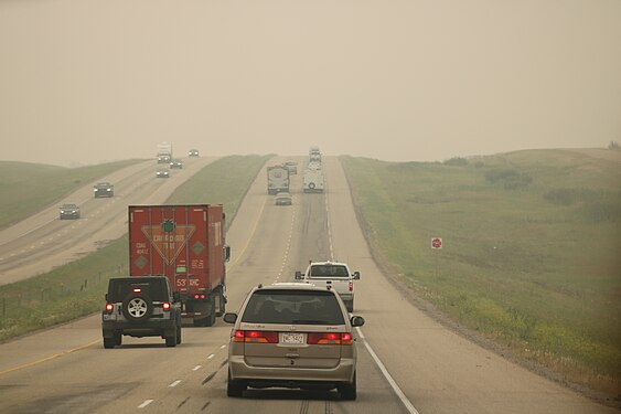 Alberta Highway 2 (Queen Elizabeth II Highway) in Mountain View County, with smoky skies due to the 2018 British Columbia wildfires