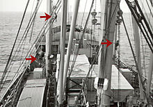 The ship's bosun, an able seaman (AB) day worker, and a watchstander AB are seen here working aloft aboard a U.S. freighter to maintain cargo rigging. 3ABs aloft.jpg