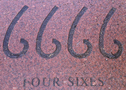 Brand of the 6666 Ranch, located in the sidewalk display of historic Texas brands, Pioneer Plaza in Dallas