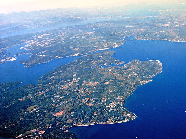 Aerial view of the northern part of Bainbridge Island adjoining Puget Sound, with Agate Passage in center, Liberty Bay on the Kitsap Peninsula in the 