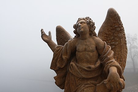 Statue of one of angels on Písek Stone Bridge in the Czech Republic