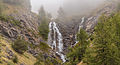 Mountain hike of Gimillan (1805m.) At Colle Tsa Sètse Cogne Valley (Italy). Waterfall above Gimillan partly in the fog.