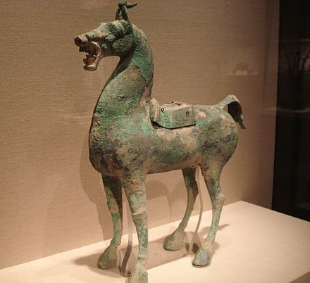 A Western or Eastern Han bronze horse with a lead saddle