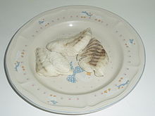 Three boiled fillets of painted sweetlips on a plate. Cooked fillets of painted sweetlips fish on a plate.JPG