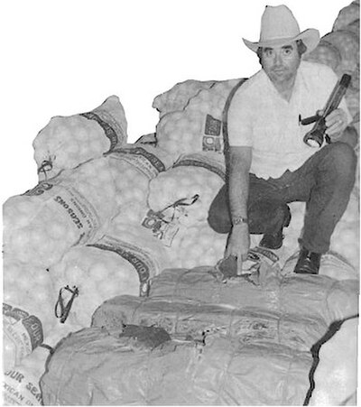 A U.S. Marshals Deputy seizing smuggled cocaine during the 1980s