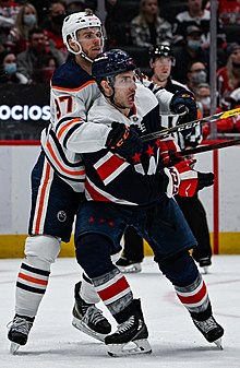 Hathaway (right) being defended by Connor McDavid in 2022
