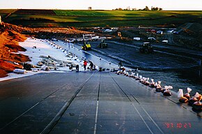 Geomembrane installation as part of the construction of a base liner system of a landfill. Geomembrane installation.jpg