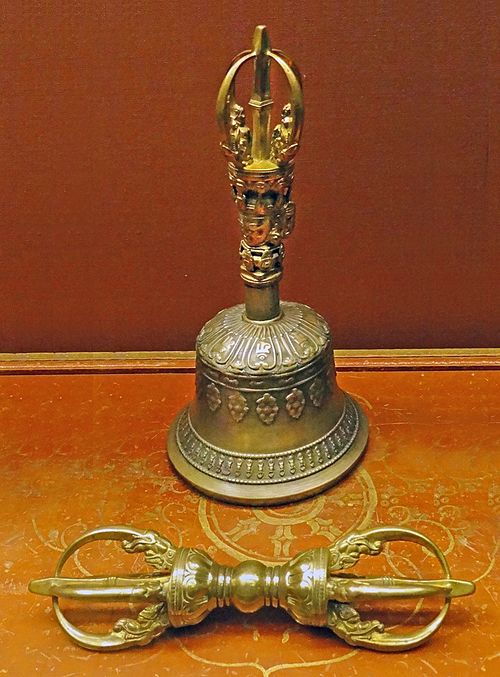 A vajra and bell (ghanta), which are classic ritual symbols of Vajrayāna