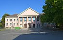 Culture house "Erich Weinert" with forecourt and park-like outdoor facilities including transformer house and OdF monument