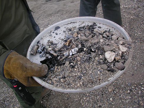 A fire pan being used in a demonstration of a "Leave No Trace" fire. Leave No Trace Fire.jpg