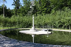 Bust of the company's founder Leube in the center of the spiral tree