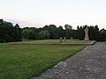 Socha Žena s dítětem od akademického sochaře Bedřicha Stefana z roku 1957. Před ní základy školy z roku 1713.