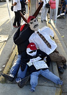 Effigies of Nicolas Maduro and other government figures that were burnt during a Burning of Judas gathering on Easter. Maduro Burning Judas 2014.jpg