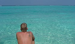 Man at the strand on island in the Maldives.jpg