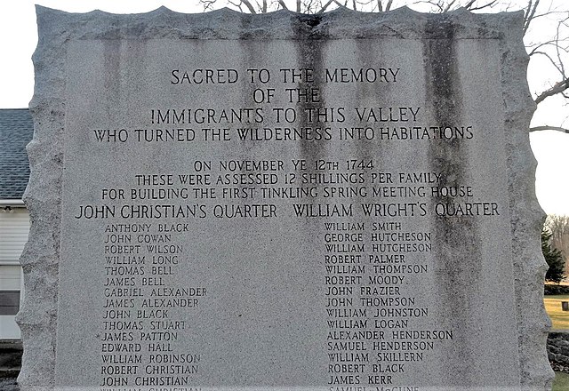 Monument to immigrants at Tinkling Spring Presbyterian Church, showing James Patton's name at the bottom left.