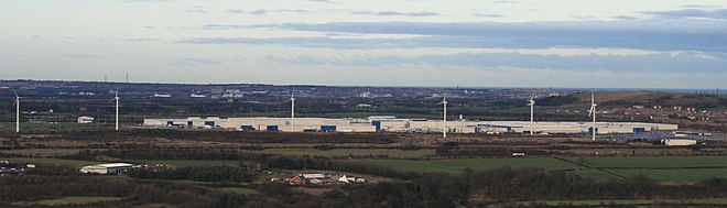 Nissan Motor Manufacturing UK Ltd in Sunderland. Factory complex, including wind turbines, taken from Penshaw Monument