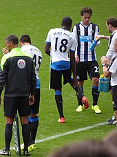 Mbemba (number 18) on his Newcastle debut in August 2015 Newcastle United vs Southampton, 9 August 2015 (21).JPG
