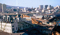 1966 photo shows sawdust-fired power plant on the edge of downtown that was removed to make way for dense residential development. High rises to left in background were early projects of the Portland Development Commission