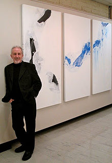 Portrait photograph of Tony Smibert with artwork.jpeg