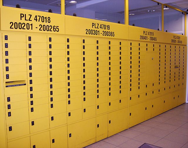 P. O. box racks in a German post office of the Duisburg post code area. The top number is the postal code (PLZ=Postleitzahl) for the individual rack.