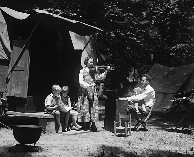 Peter Seeger (on father's lap) with his father and mother, Charles and Constance Seeger and brothers on a camping trip (May 23, 1921)