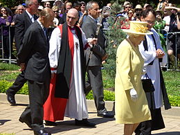 Robinson (in red) talking with the Duke of Edinburgh during a royal visit to Australia in 2011 Queen Elizabeth and Prince Phillip with Canberra Anglicans 23Oct11.jpg