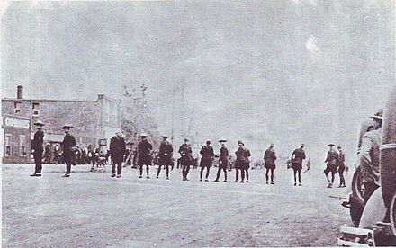 RCMP officers confronting striking coal miners during the Estevan riot.