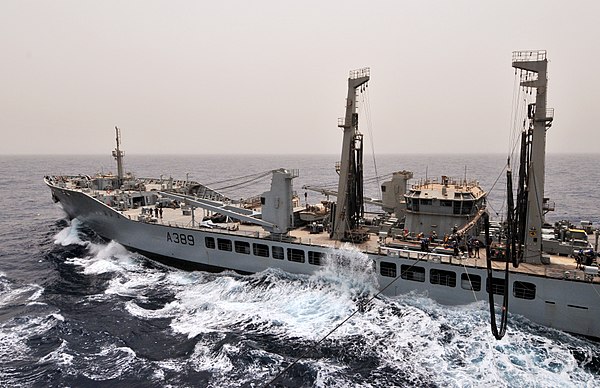 Wave Knight prepares to transfer fuel to the amphibious assault ship USS Bataan during a replenishment at sea.