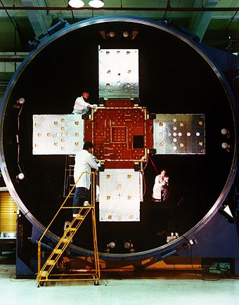 Technicians at the Naval Research Laboratory (NRL) work on the Low-powered Atmosphere Compensation Experiment (LACE) satellite.