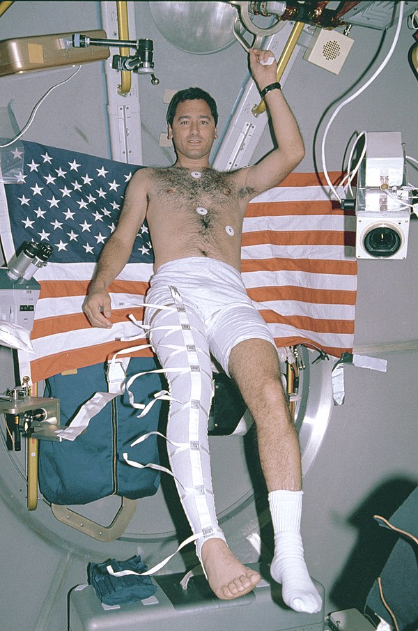 Lawrence DeLucas wearing stocking plethysmograph during mission.