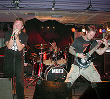 Scott Hull (far right) playing guitar with Pig Destroyer