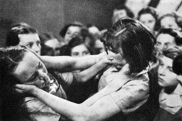 A fight breaks out at school between Midge Carne (Glynis Johns, left) and Lydia Holly (Joan Ellum) in the 1938 film South Riding, produced by Alexande
