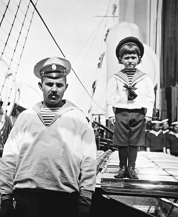 Alexei (right) with his sailor nanny Andrei Derevenko aboard the Imperial yacht Standart in 1908