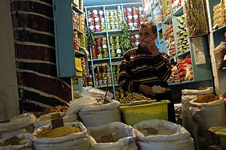 A souk shopkeeper Tunismarketseller.jpg