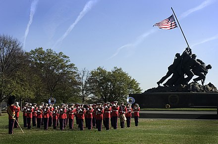 The Marine Band performing for an audience attending a wreath laying ceremony honoring the United States Marine Corps' 229th birthday at the Marine Corps War Memorial
