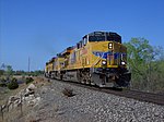 Three Union Pacific GEVOs about to cross the Arkansas River in Hutchinson, Kansas, in 2008