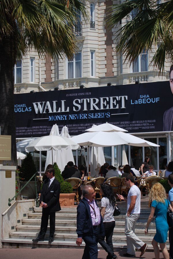 An advertisement for Wall Street: Money Never Sleeps at the 2010 Cannes Film Festival