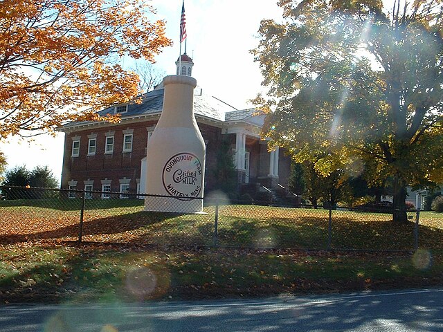 The "Whately Milk Bottle" in front of the old Whately Central School (built 1910)