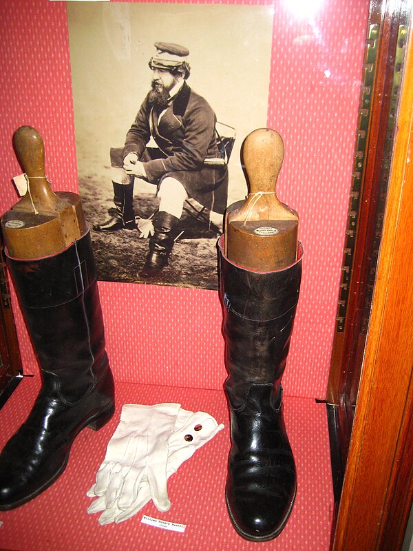 Display at the Frontline Club featuring the boots of William Howard Russell