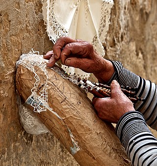 Hands of a person creating lace