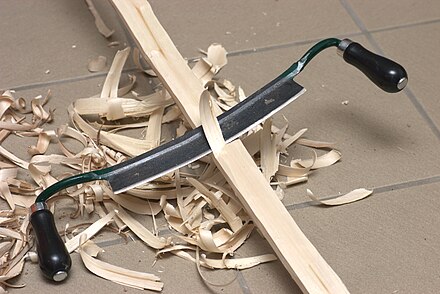 Using a drawknife in making a flatbow