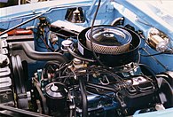 Shows the engine compartment with a "Go Package" 390 CID V8