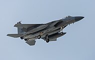 A US Air Force F-15C Eagle, tail number 84-0025, on final approach at Kadena Air Base in Okinawa, Japan. The aircraft is assigned to the 18th Wing.