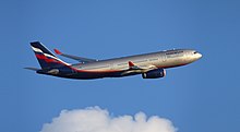 A silver, white, blue and red Aeroflot A330 after takeoff, flying across a blue sky background.
