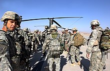 Kandahar Airfield, Afghanistan: Members of the 508th Parachute Infantry Regiment prepare for air assault on Musa Qala. Assaultemminent.jpg