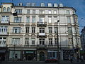 Apartment house in a corner and closed development