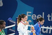 Deutsch: Boxen bei den Olympischen Jugendspielen 2018 Tag 12, 18. Oktober 2018 - Medaillenzeremonie im Fliegengewicht der Mädchen - Gold: Martina La Piana (Italien), Silber: Adijat Gbadamosi (Nigeria), Bronze: Heaven Destiny Garcia (USA); Medaillenübergabe durch Habu Gumel (IOC, Nigeria), Geschenkübergabe durch Dr. Joseph O. Ayeni (Nigeria, AIBA). English: Boxing at the 2018 Summer Youth Olympics on 18 October 2018 – Girl's flyweight Medal Ceremony - Gold: Martina La Piana (Italy), Silver: Adijat Gbadamosi (Nigeria), Bronze: Heaven Destiny Garcia (USA); Medal handover by Habu Gumel (IOC, Nigeria), Gift presented by Dr. Joseph O. Ayeni (Nigeria, AIBA). Español: Boxeo en los Juegos Olímpicos Juveniles de Verano de 2018 en 18 de octubre de 2018 - Ceremonia de la Medalla de peso mosca para niñas - Oro: Martina La Piana (Italia), Plata: Adijat Gbadamosi (Nigeria), Bronce: Heaven Destiny Garcia (Estados Unidos); Entrega de medallas por Habu Gumel (COI, Nigeria), Regalo presentado por Joseph O. Ayeni (Nigeria, AIBA).